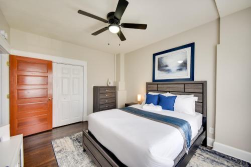 a bedroom with a bed and a ceiling fan at Modern Portsmouth Apartment Walk to Norfolk Ferry in Portsmouth