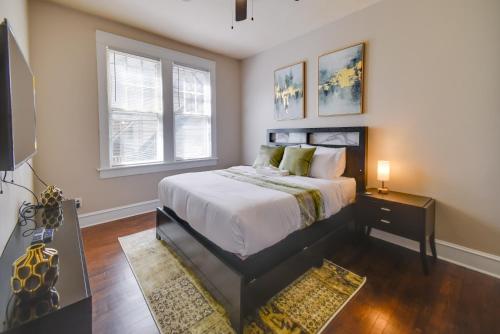 a bedroom with a large bed and a window at Waterfront Portsmouth Apt half Mi to Dtwn and Ferry in Portsmouth