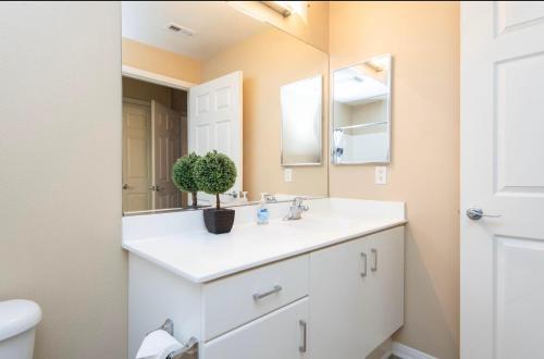 a bathroom with a sink and a mirror at Two bedroom 2 bath close to Disneyland CA in Anaheim