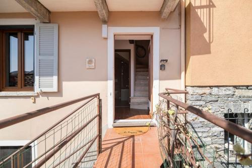 a staircase leading to a door of a house at Come Relax and Enjoy the Breathtaking Views in Brissago
