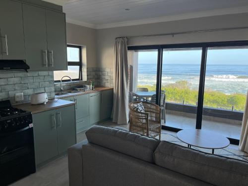 A kitchen or kitchenette at White Sands Self-catering units