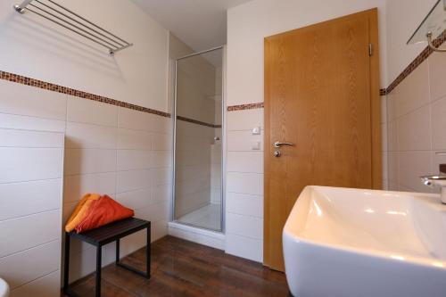 a bathroom with a tub and a sink and a shower at Ferienwohnungen auf dem Paulbauernhof in Triebenbach