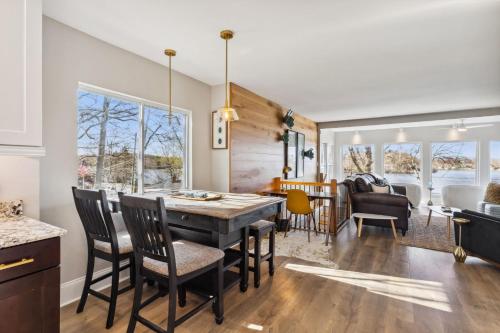 a kitchen and dining room with a table and chairs at Hilltop Lakehouse - Free Kayaks Deck PLX in Akron