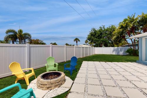 a backyard with chairs and a fire pit at Nokomis Nirvana in Nokomis