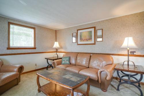 a living room with a couch and a table at Dandridge Cabin in Inspiration Cove with Lake Access in Dandridge