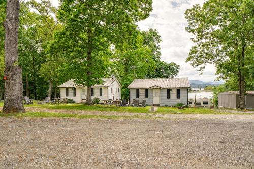 a couple of white houses in the woods at Dandridge Cabin in Inspiration Cove with Lake Access in Dandridge