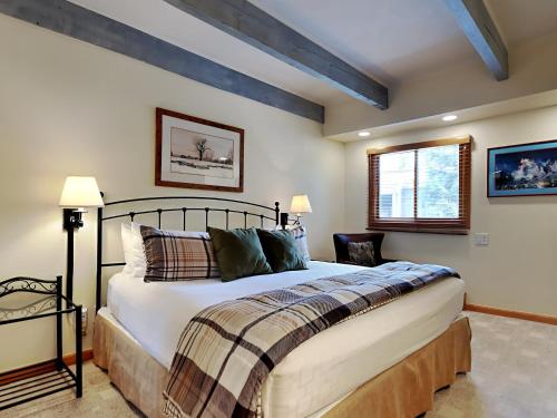 a bedroom with a large bed and a window at Timberline Condominiums 1 Bedroom Standard Unit C1C in Snowmass Village