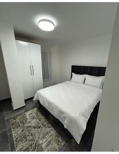 Кровать или кровати в номере Star apartman
