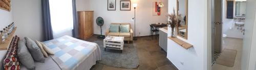 a room with a bed and a bathroom with a sink at Apartamento los 3B in Manabao