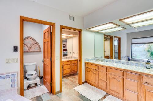 a bathroom with a toilet and a sink at Beautiful Tucson Oasis with Pool, Views and Privacy! in Tucson
