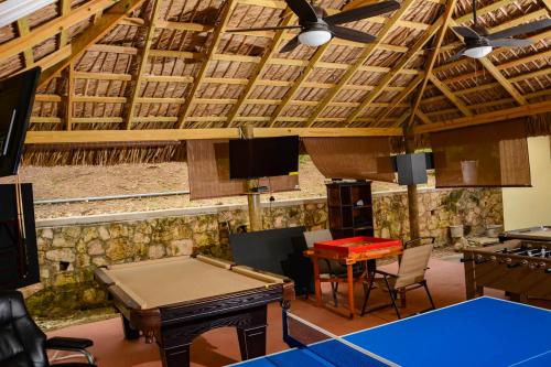 a ping pong room with a ping pong table at Bella Vista Vacation in Montego Bay