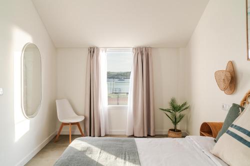 Ένα ή περισσότερα κρεβάτια σε δωμάτιο στο Villas de La Ribera