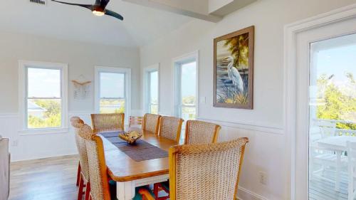 a dining room with a table and chairs at Sundancer in Southport
