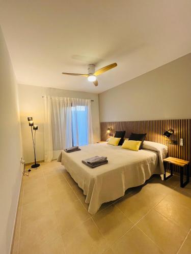 a bedroom with a large bed and a window at Villa Salitre in Costa de Antigua