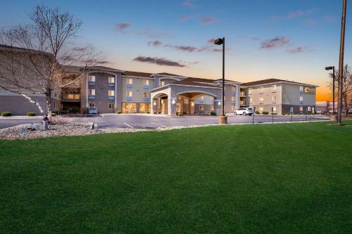 a building with a green lawn in front of it at Comfort Inn & Suites Springfield I-55 in Springfield