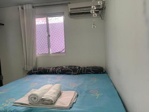 Ένα ή περισσότερα κρεβάτια σε δωμάτιο στο Cobertura com area de lazer privada com piscina infantil