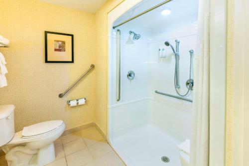 a bathroom with a shower and a toilet at Comfort Inn & Suites in Kincardine