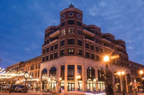 a large building with a clock tower on top of it at Jefferson Street Inn in Wausau