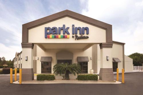 a park inn building with a sign on it at Park Inn by Radisson Albany in Albany