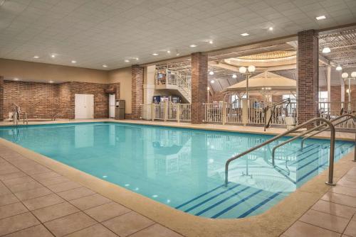 a large swimming pool in a hotel room at Radisson Hotel and Conference Center Fond du Lac in Fond du Lac