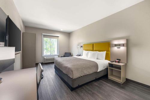 a hotel room with a large bed and a window at Quality Inn & Suites Joelton - Nashville in Joelton