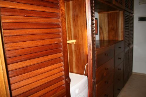 a bathroom with a wooden door and a sink at Home sweet home in Santa Maria