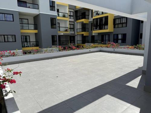 an empty courtyard of an apartment building at Cozy 2 Bedroom Apartment. in Santo Domingo