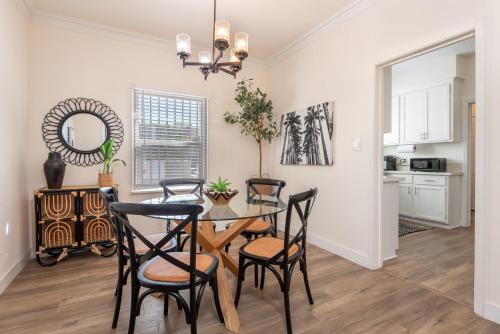 a kitchen and dining room with a table and chairs at Exquisite 1BR Suite ahead of Cedar-Sinai Hospital in Los Angeles