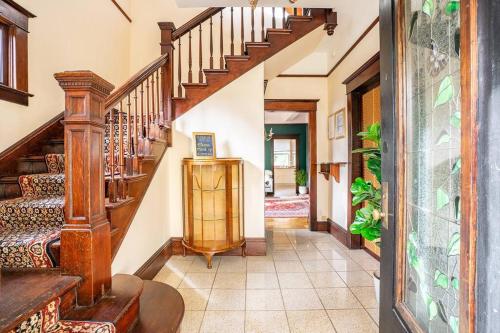 a hallway with a wooden staircase in a house at Charming Room in Capitol Hill - Foxglove Inn Rm 8 in Seattle