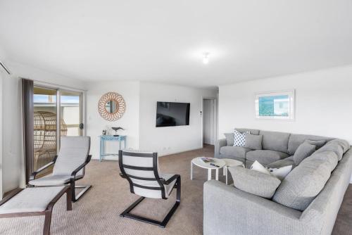 a living room with a couch and chairs at Strandhytta 10 Cant Rd Goolwa South - No Linen Included in Goolwa South