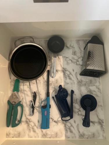 a counter top with a pot and other kitchen tools at ※ Cul-de-Sac Haven, Stylish & Tranquil ~ King Beds in Forney