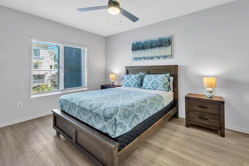 a bedroom with a large bed and a window at Spacious two bedroom one bath In Little Italy in San Diego
