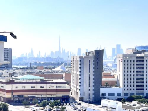 a view of a city with tall buildings at Private Room in beautiful Appartment in Dubai