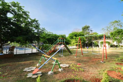 a park with a playground with a swing set at MGM Whispering Wind's Yelagiri in Yelagiri
