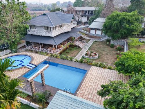 an aerial view of a house with a swimming pool at MGM Whispering Wind's Yelagiri in Yelagiri