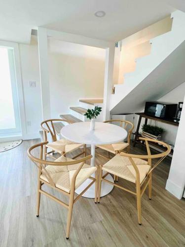 a dining room with a table and chairs at La Casita in Miami