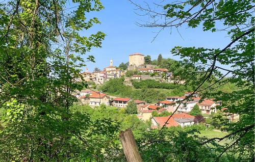 a town on top of a hill with houses at Cozy Home In Marsaglia With Kitchen in Marsaglia