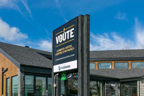 a sign in front of a building at Complexe La Voûte by Gestion ELITE in Laval