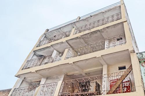 a building with balconies on the side of it at SPOT ON 81062 Moonlight Hotel in Bhilai