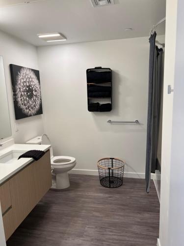 a bathroom with a toilet and a sink at Alameda Bay Living in Alameda