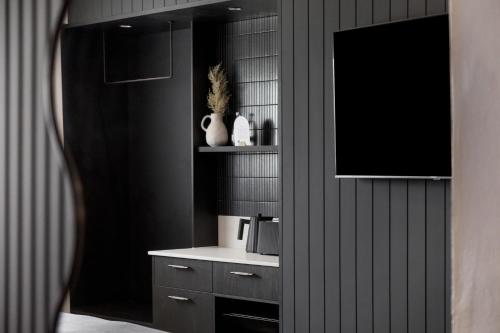 a kitchen with a sink and a microwave at The Lodge - 4 Luxury Central Private Studio Rooms - Free wifi in Mount Gambier