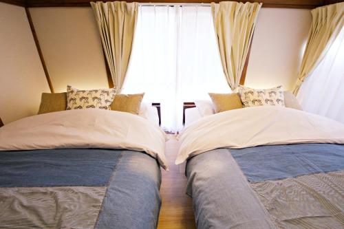 Katil atau katil-katil dalam bilik di -Takaya house- Minamirokugou close Haneda AP