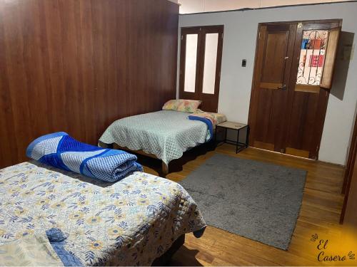מיטה או מיטות בחדר ב-Acogedora y Céntrica Habitación - H. El Casero