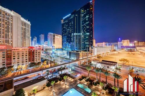 a city skyline at night with tall buildings at MGM Signature-08-801 1Br2Ba F1 Strip View Balcony in Las Vegas
