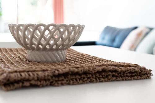 a white bowl sitting on top of a table at Riverside Gem with Parking and WiFi in Alanvale