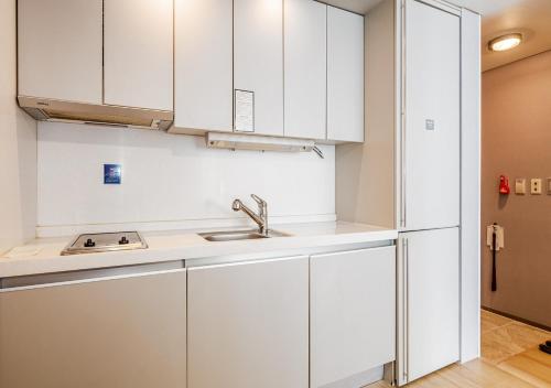 Kuchyň nebo kuchyňský kout v ubytování Haeundae Seacloud Hotel Residence