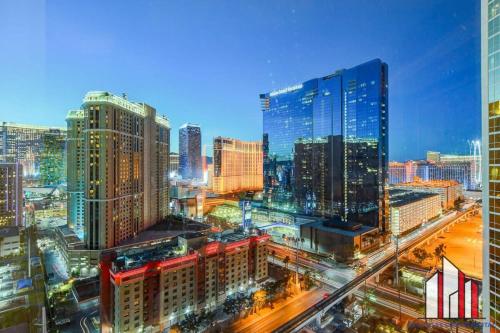 a view of a city at night with buildings at MGM Signature-23-811 F1 Track & Strip View Studio in Las Vegas