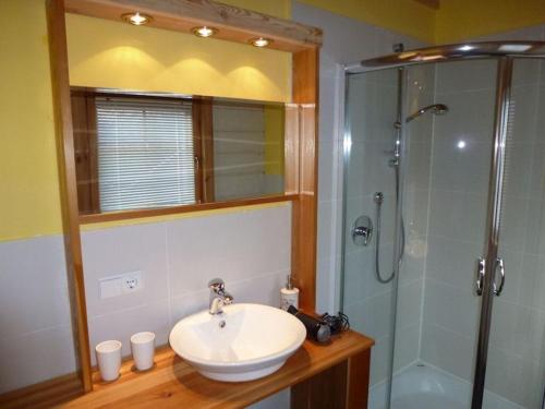 a bathroom with a sink and a shower at Holiday apartment Kleinlehenhof in Naturno