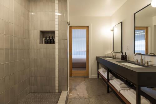 a bathroom with a sink and a mirror at Best Bet Motor Lodge in Reno