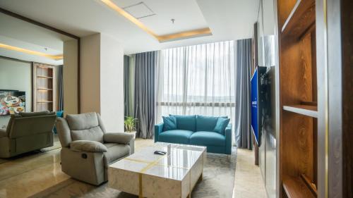 Χώρος καθιστικού στο Bigland Bogor Hotel Powered by Archipelago